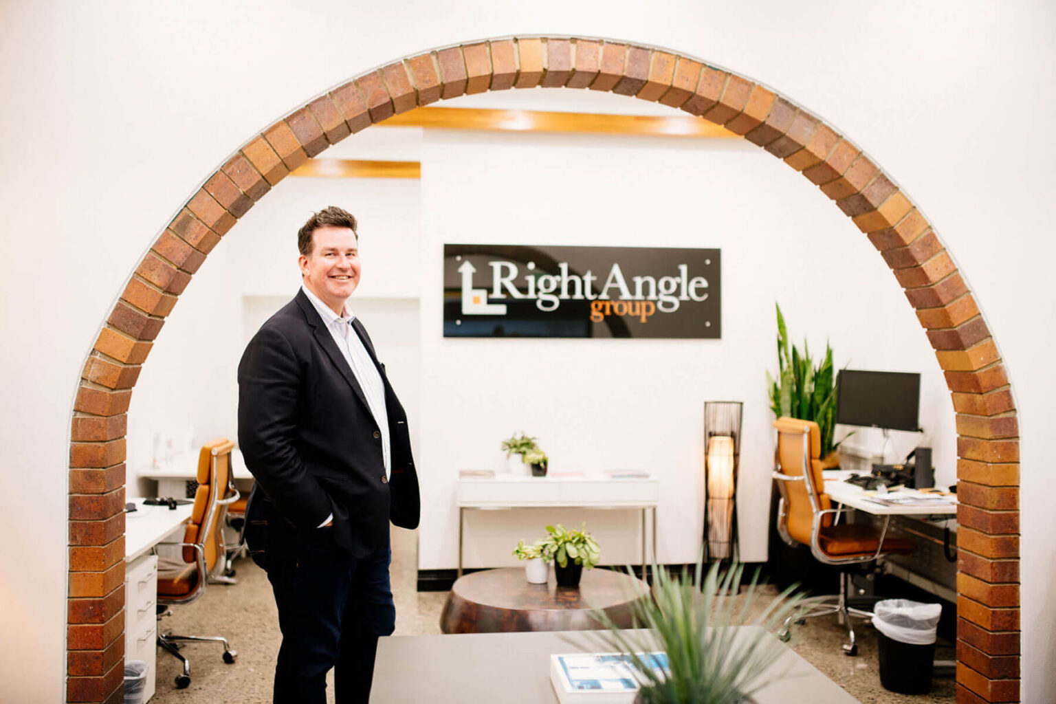 Mark Hayes, Director, standing in the Right Angle Group office